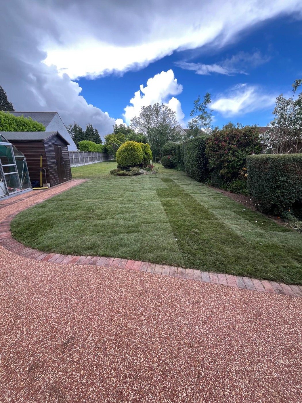 A freshly laid, striped real-turf lawn