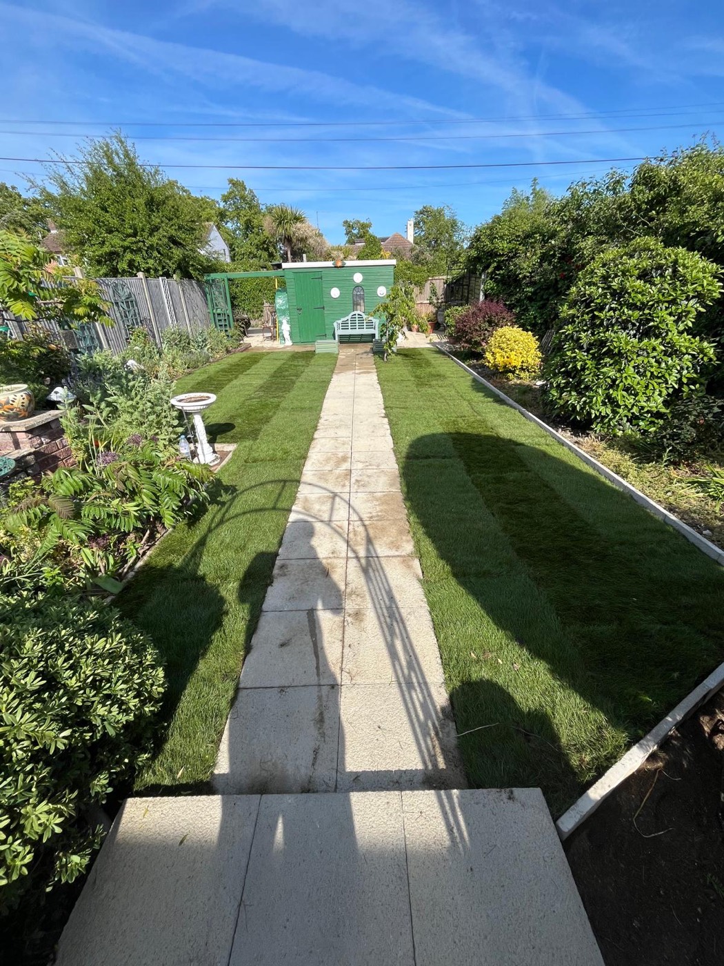 A fully landscaped garden with new lawn, path and beds
